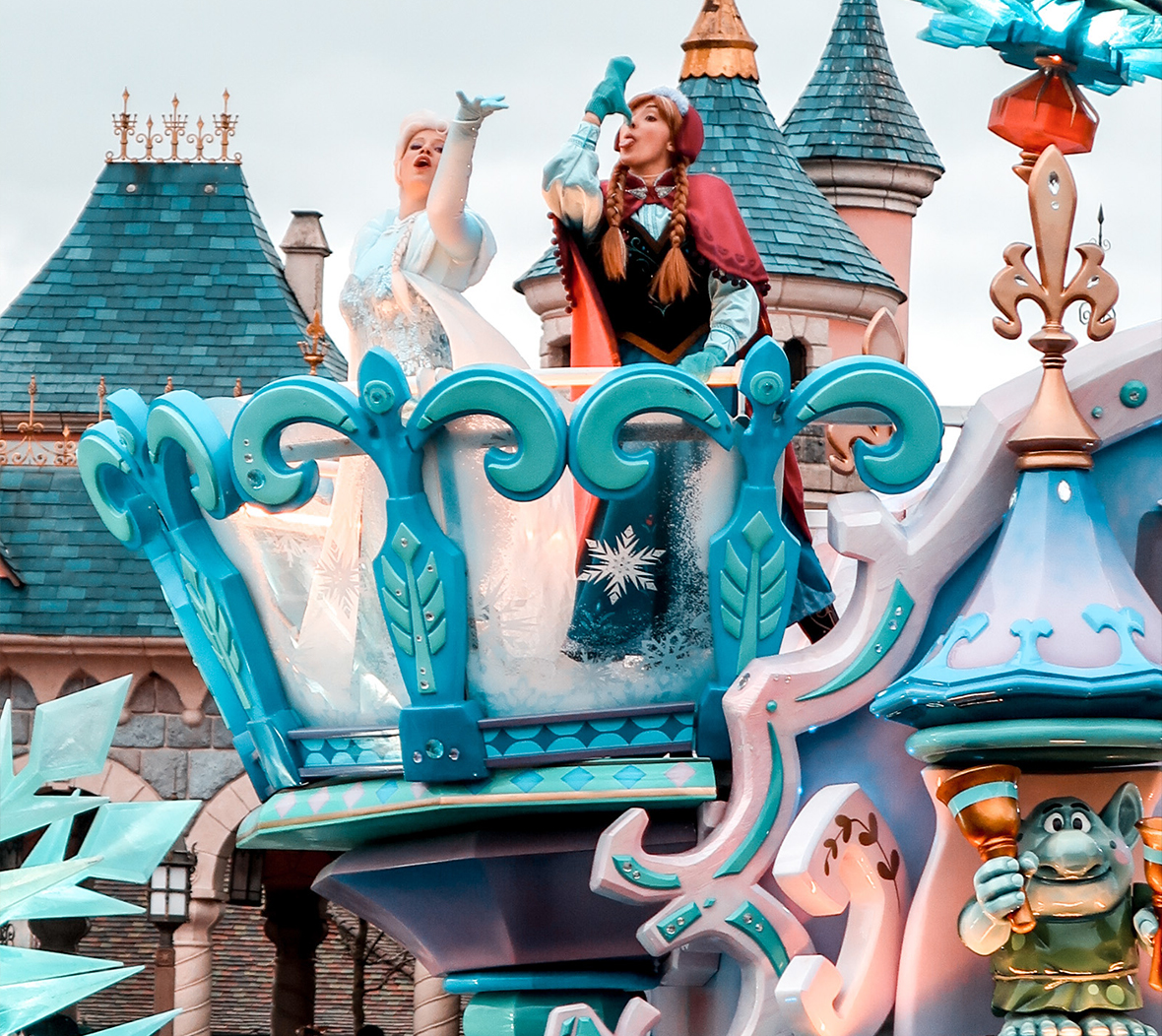 Disney’s Elsa and Anna from Frozen on a carnival float in a Disneyland Paris parade